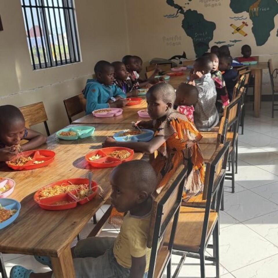Children at Huruma orphanage in Arusha, Tanzania gather in the dining room where caregivers provide not just shelter but a family