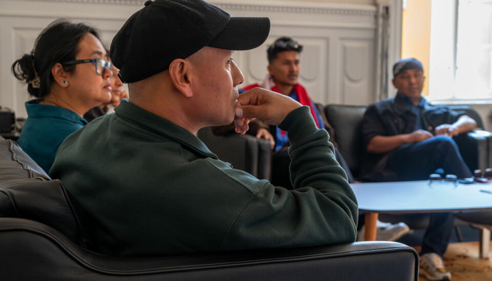 Nepal Embassy staff listen to the messages from Bel Gurung and other protesters in the Nepal Embassy in Copenhagen.