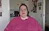 Et portrætbillede af Antoniett iført lyserød sweater.