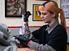 Tattoo artist Matilde works on Gitte’s leg in a studio in Aarhus.